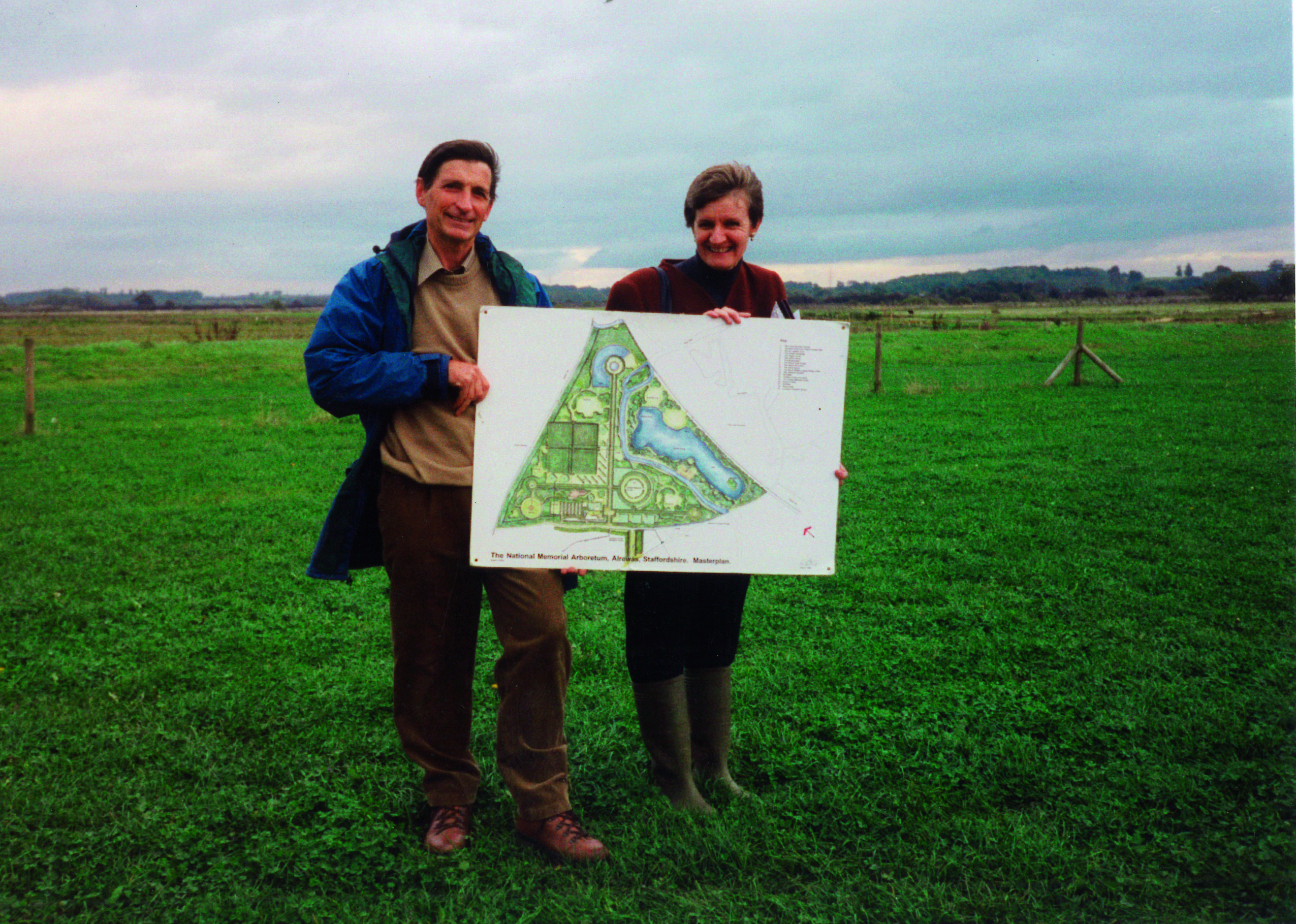 David Childs holding a very early plan for the Gardens site.