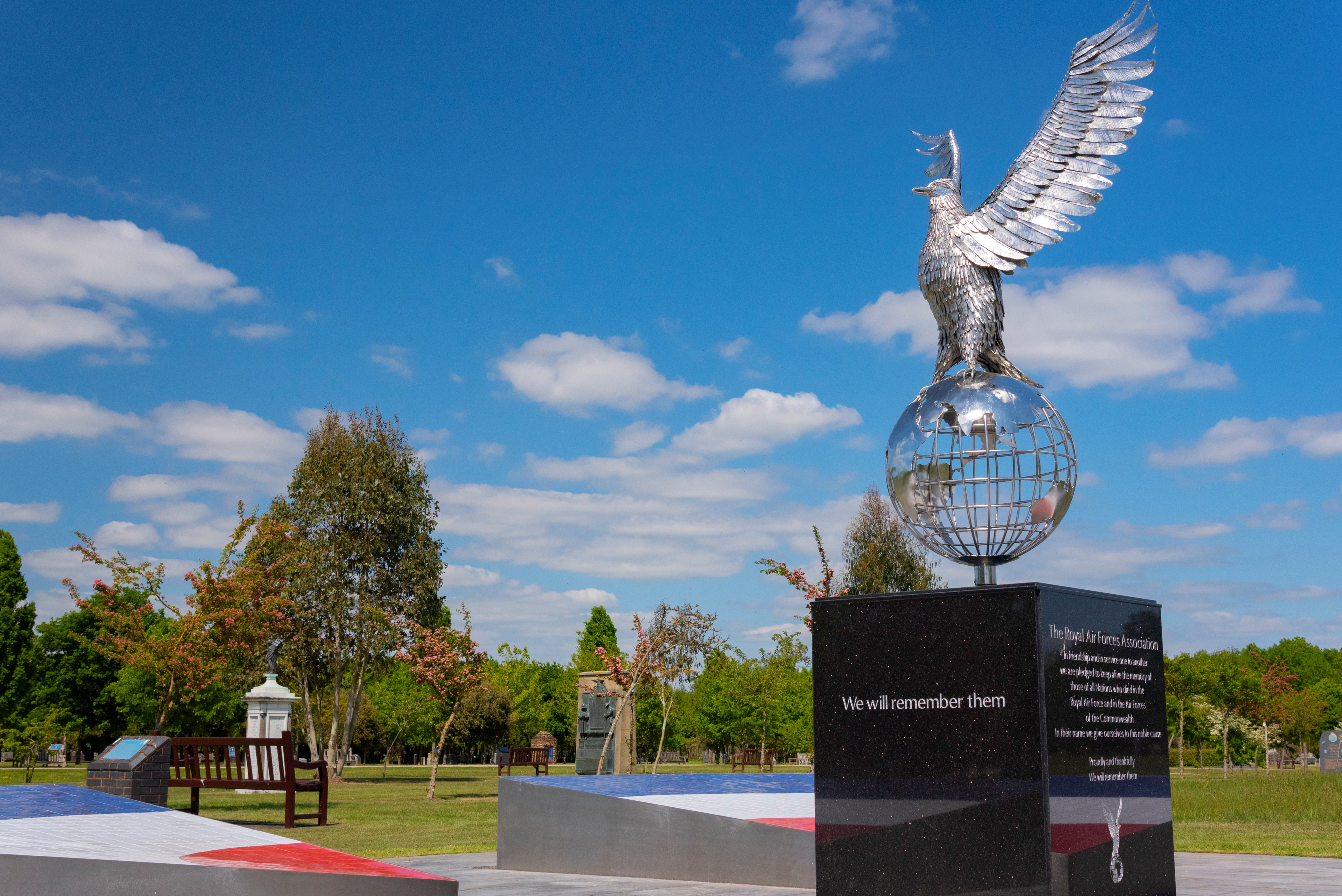 RAF Association memorial garden featuring a large silver eagle statue atop a globe.