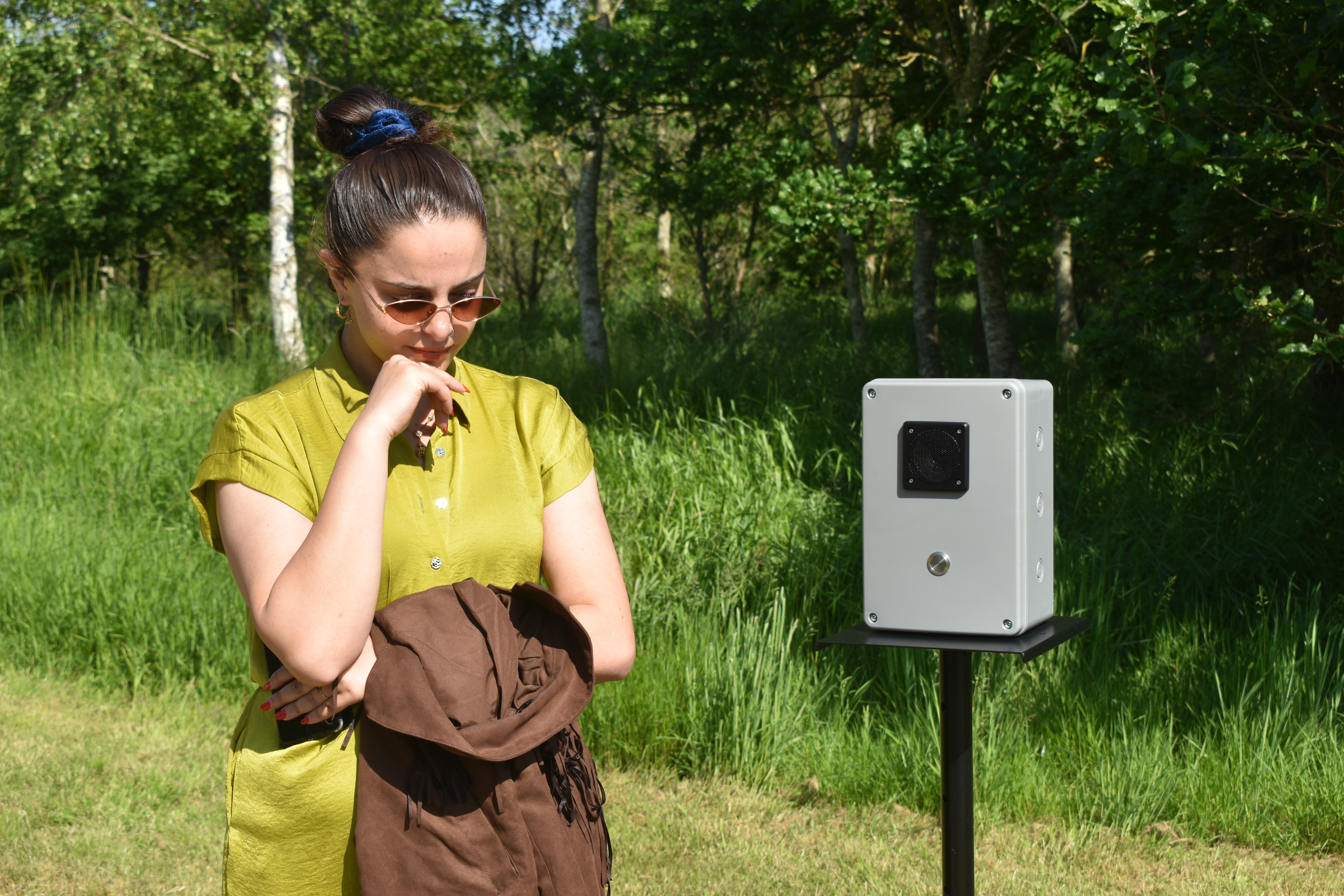 Artist Nafeesa Hamid listens to oral histories recorded for the exhibition Together in a World Apart