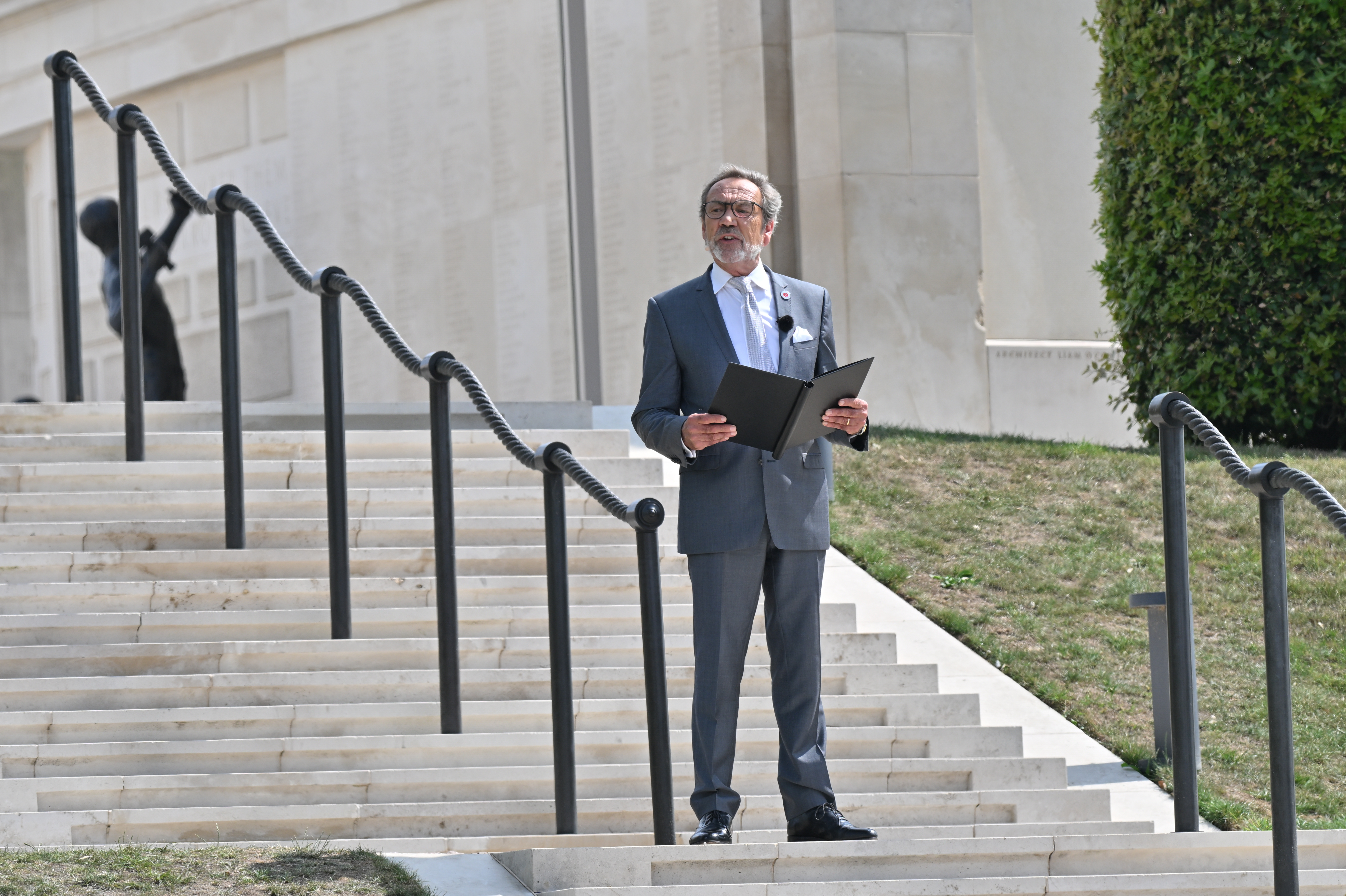 Actor Robert Lindsey reads a testimonial during the service
