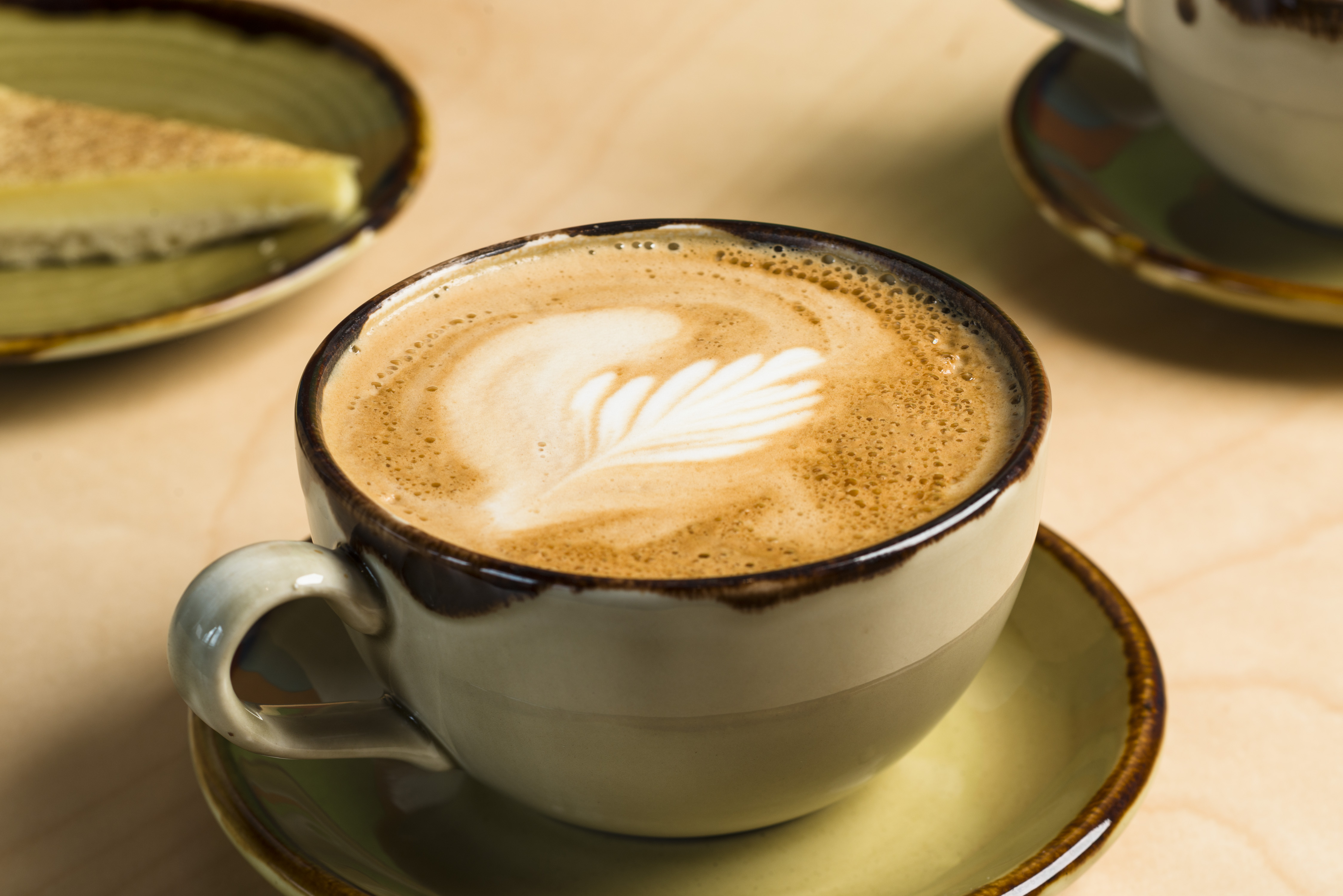 A cup of fresh coffee in a green mug