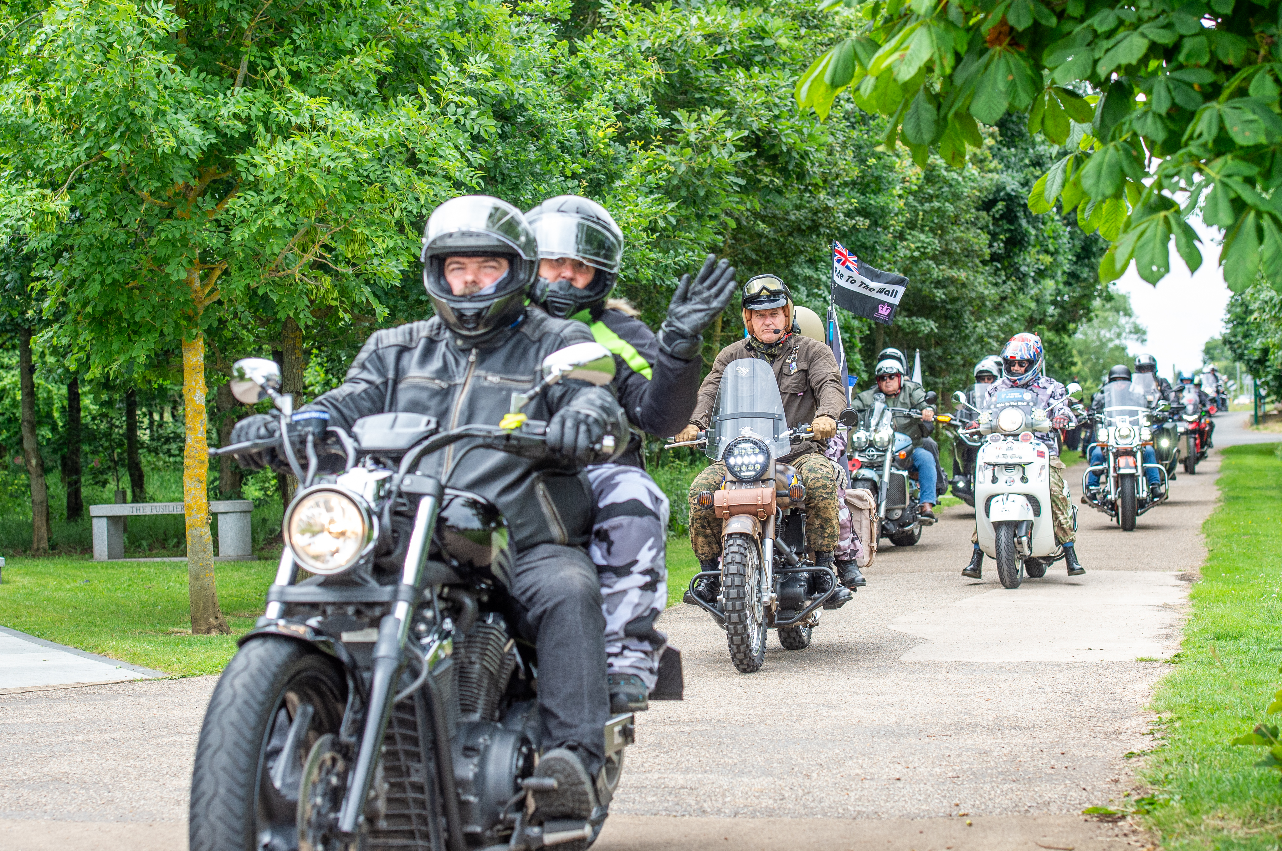 A group of Ride to the Wall bikes arrive at the National Remembrance Gardens