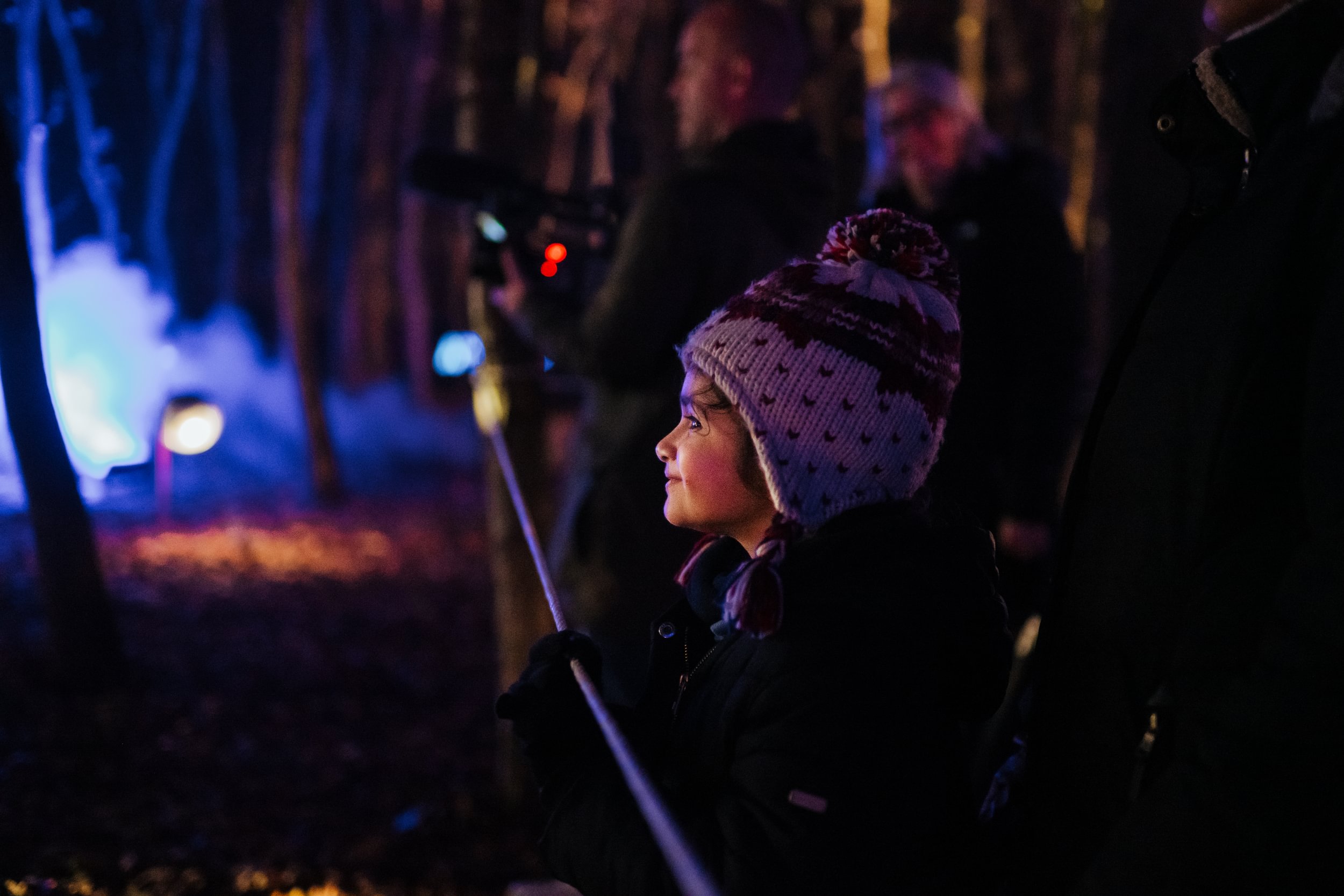 A young child looking in wonder at one of the Illuminated displays in 2023.