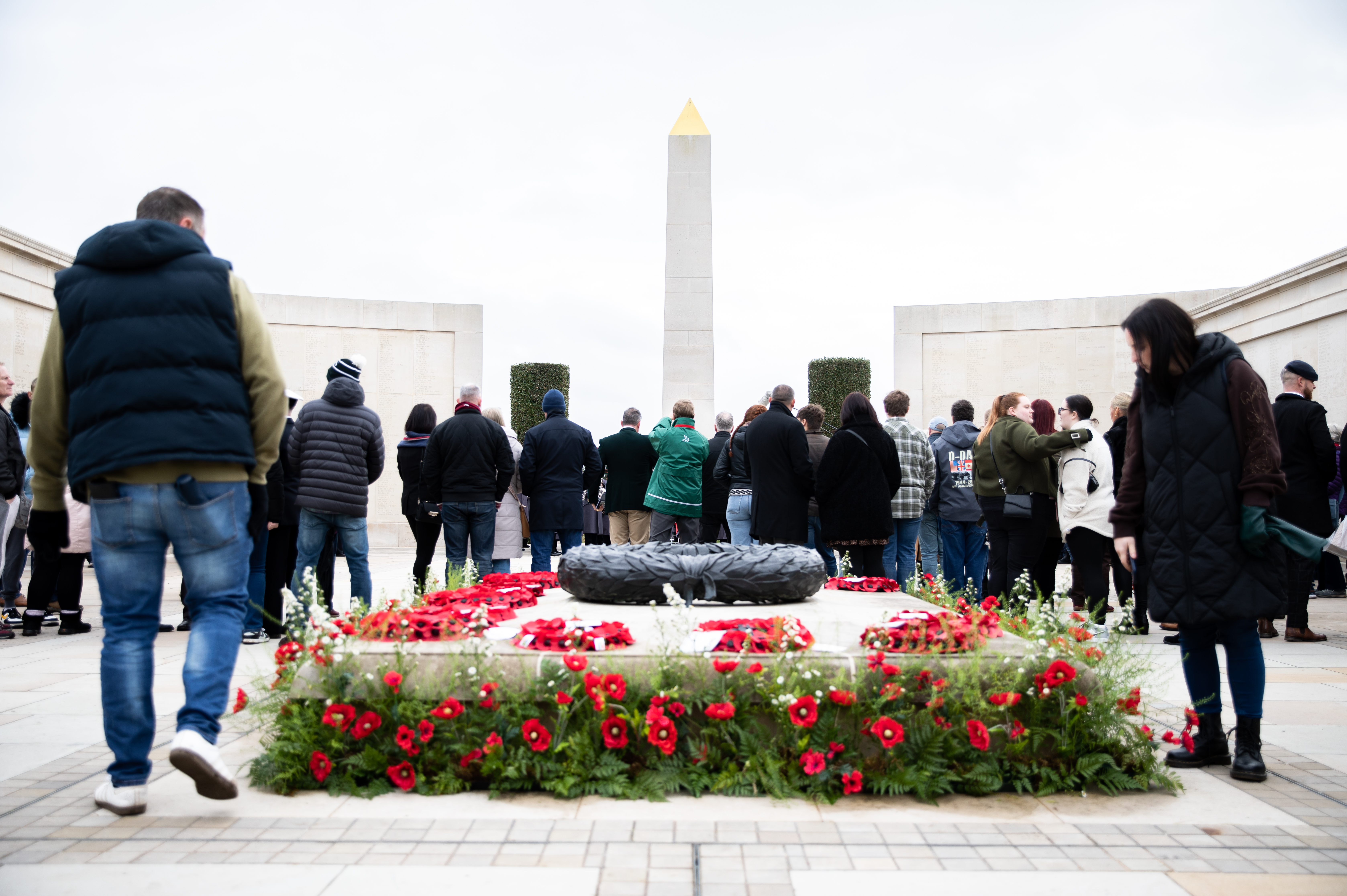 Visitors standing on the Armed Forces Memorial for Remembrance Sunday