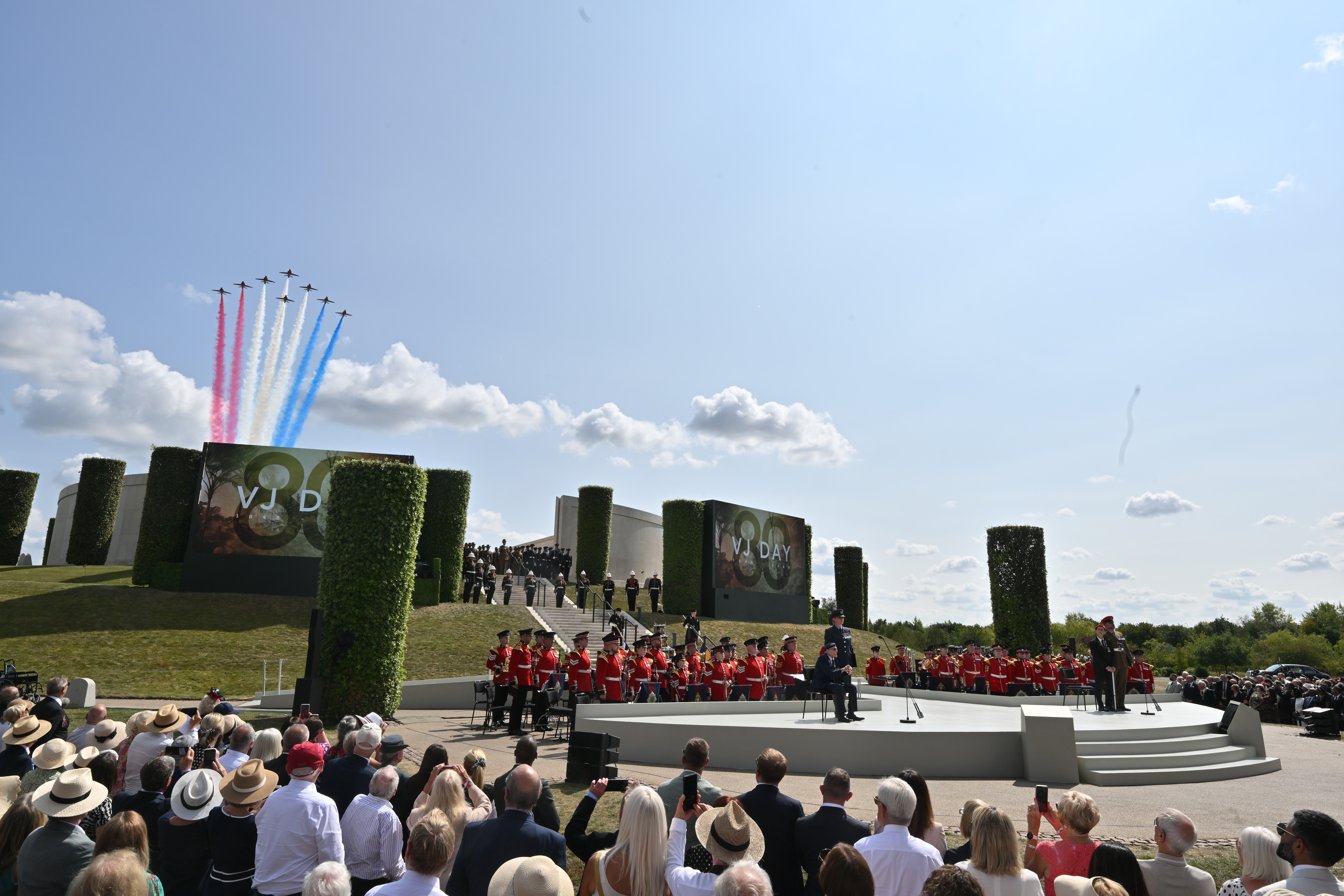 The Red Arrows fly over the Armed Forces Memorial