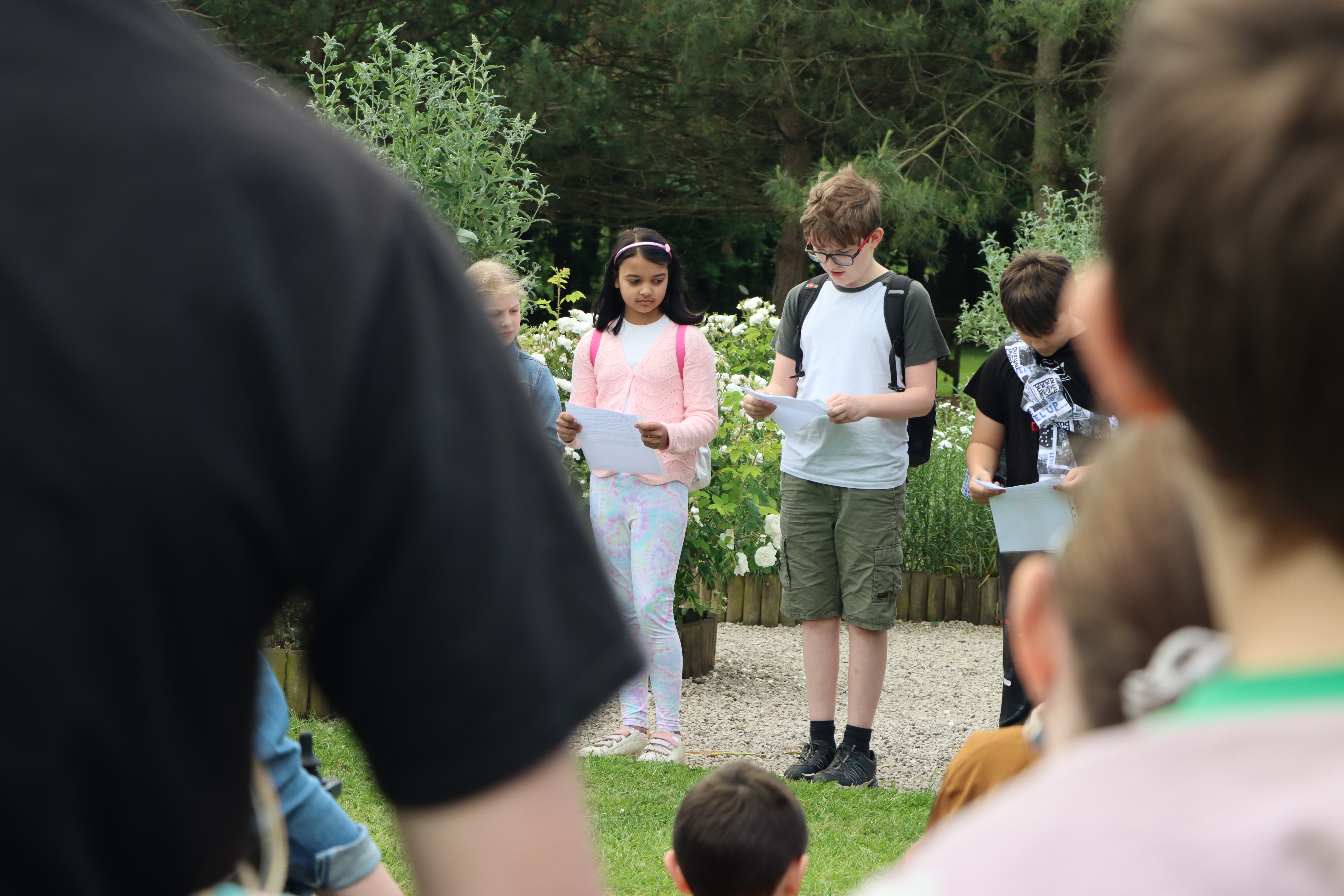 Children participating in an Act of Remembrance at the Garden of Innocents Memorial
