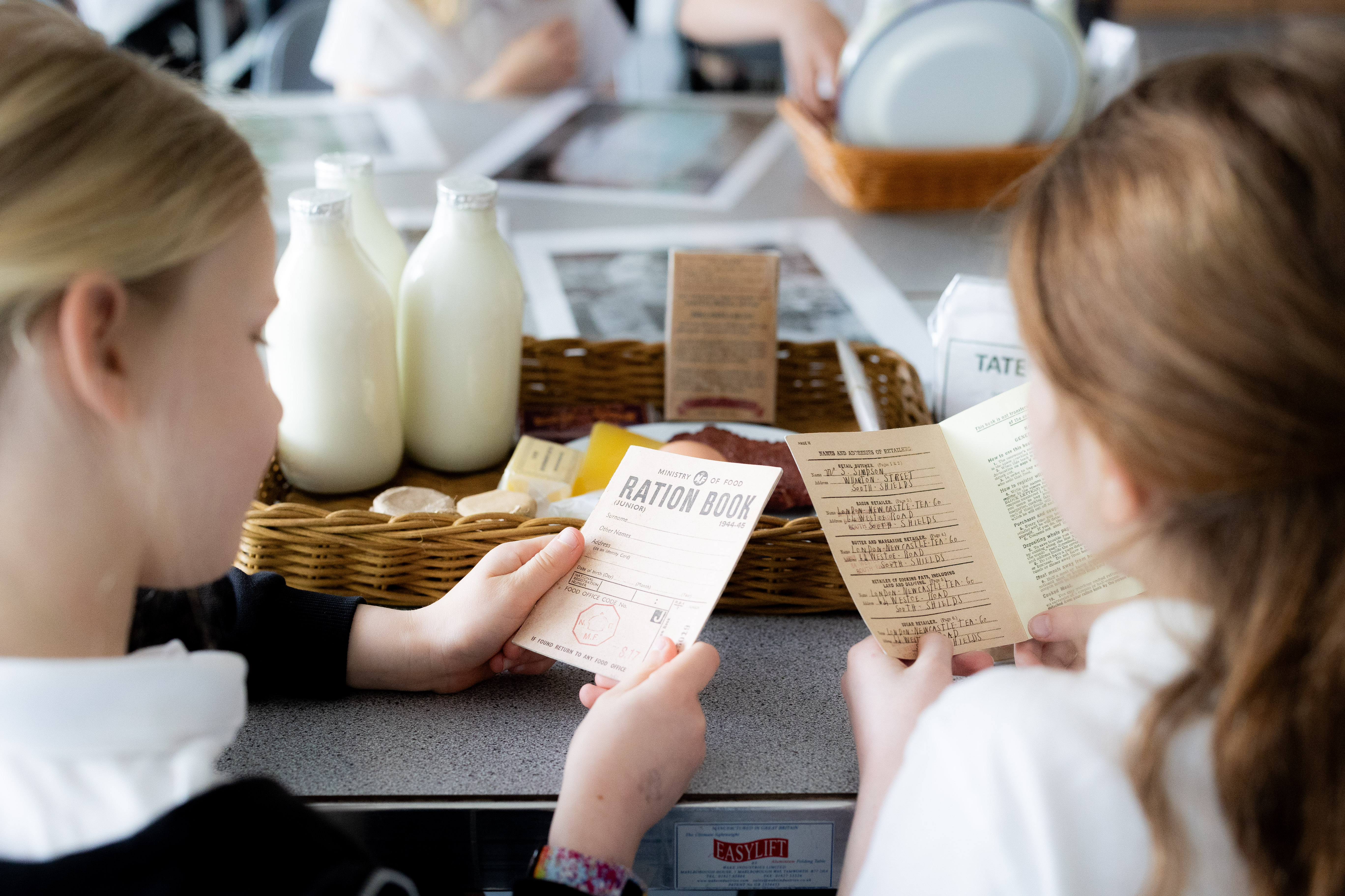 School Chidlren Taking part in a WW2 Explorer Day, looking at ration packs