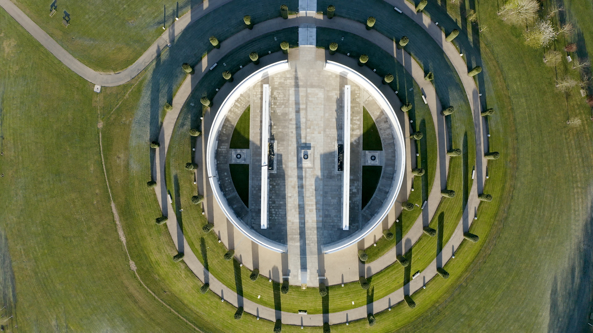 Aerial view of the Armed Forces Memorial, looking down at the spiral pathway lined with trees.