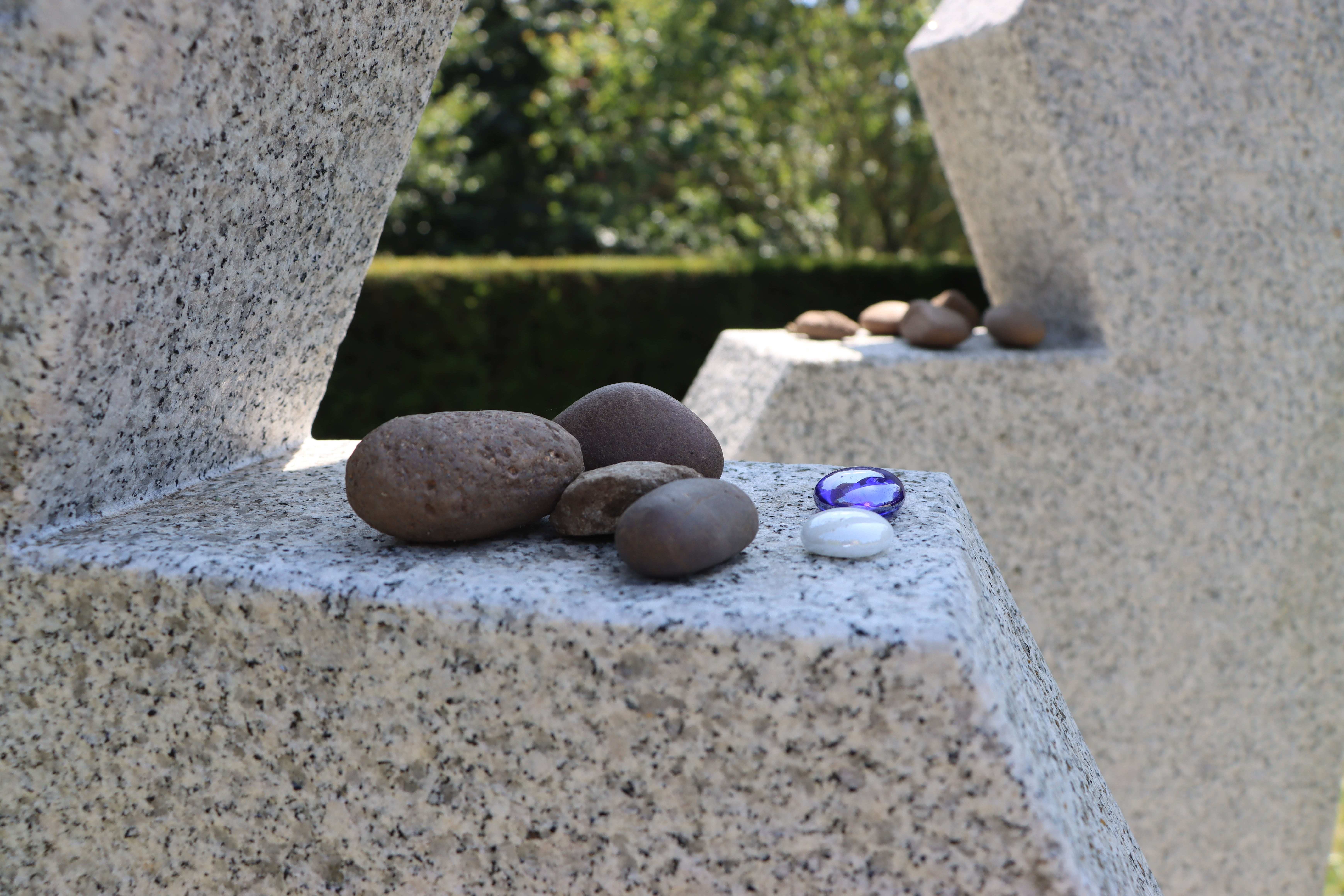 Rocks left in Remembrance on the AJEX Memorial at the National Remembrance Gardens