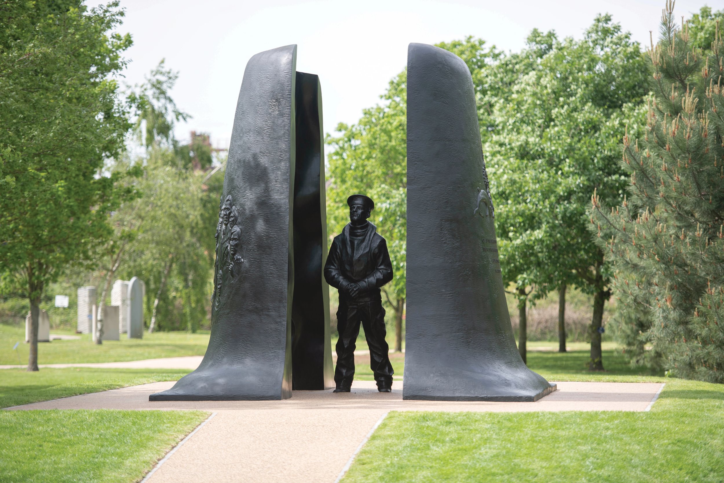 The submariners memorial features a sailor at ease between two portions of a submarine.