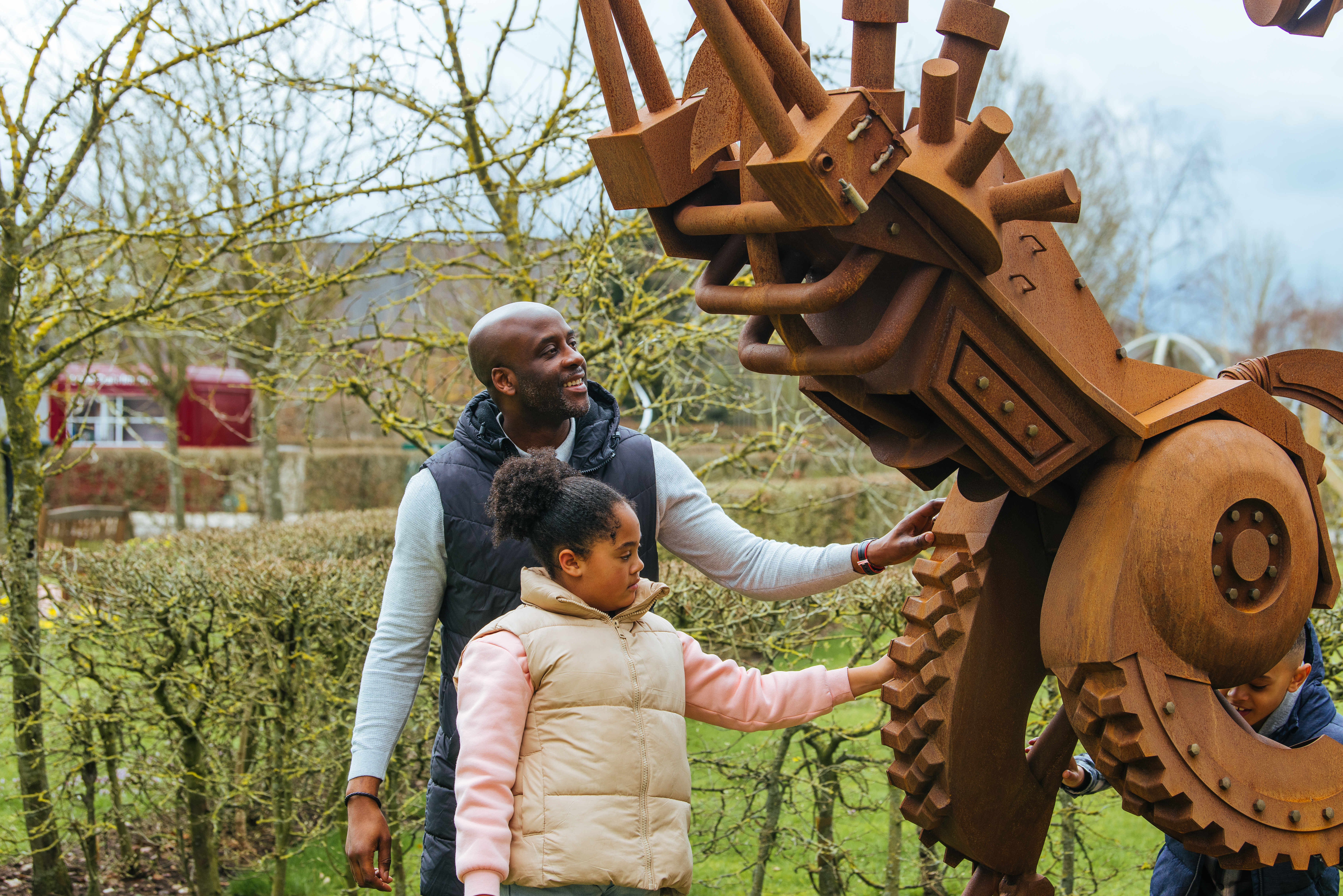 A family of four look at the Cheshire Yeomanry Memorial